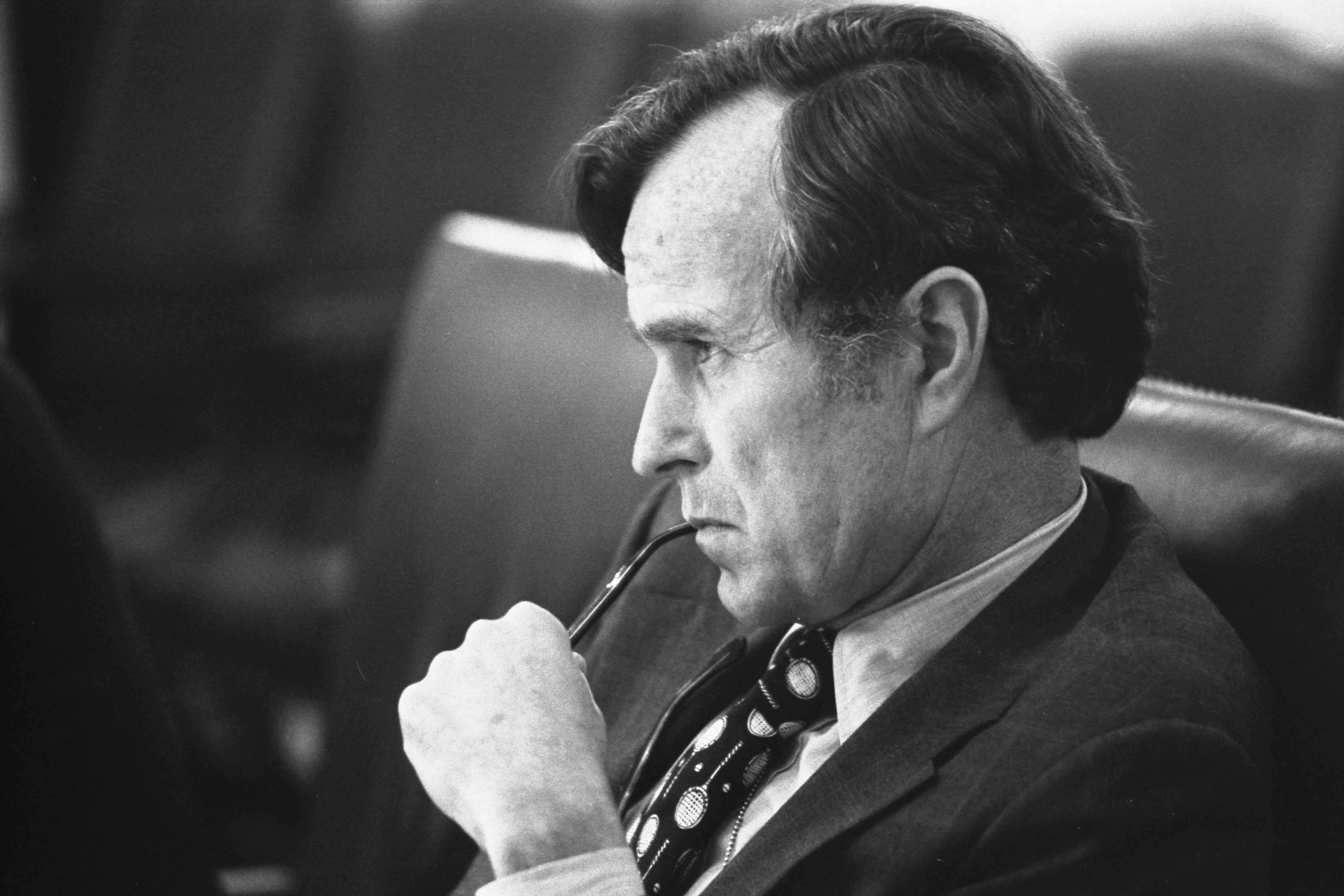 CIA_Director_George_H.W._Bush_listens_at_a_meeting_following_the_assassinations_in_Beirut,_1976_-_NARA_-_7064954.jpg