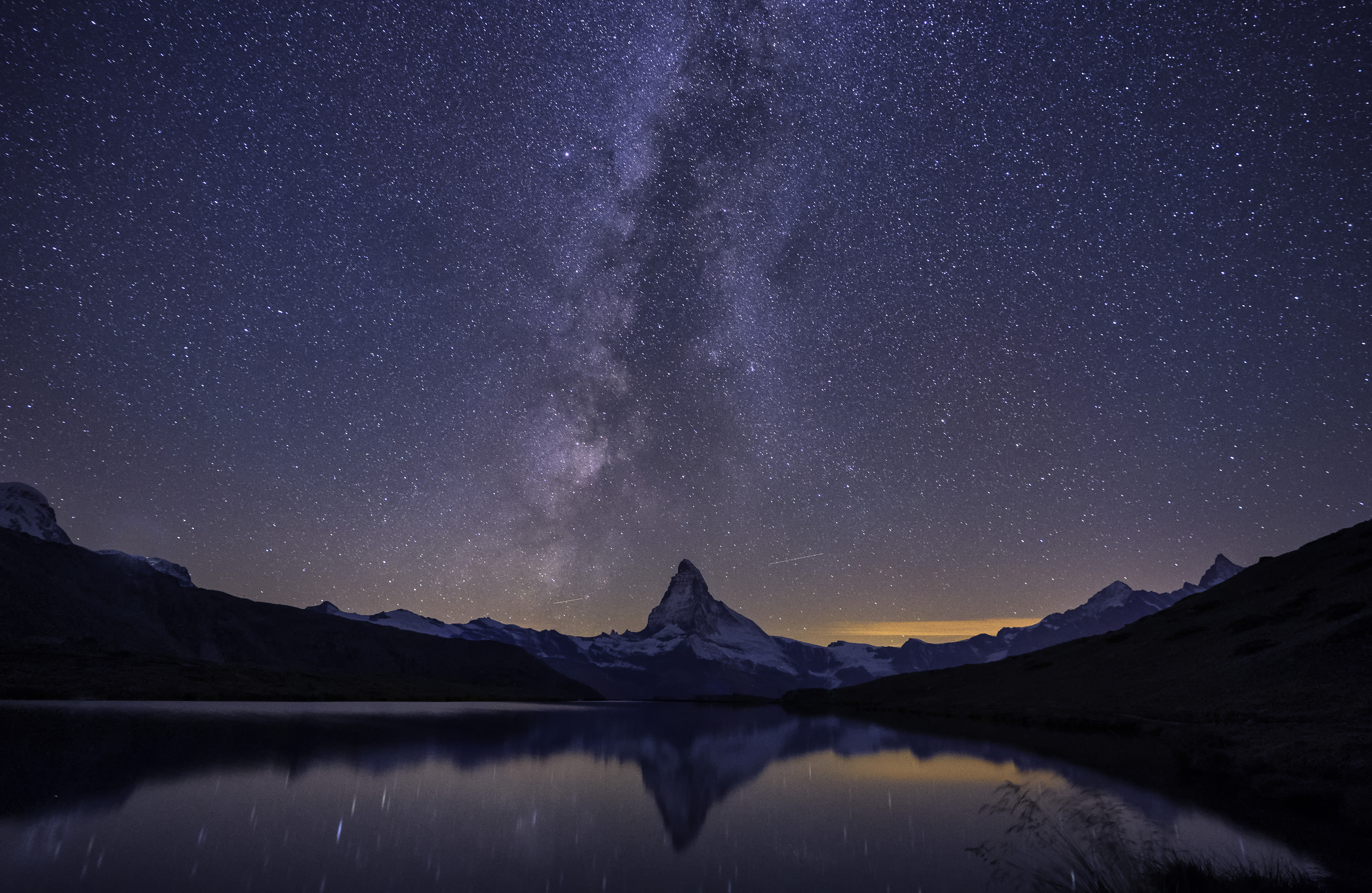 Matterhorn,a milky way and a reflection near the lake at night, Switzerland