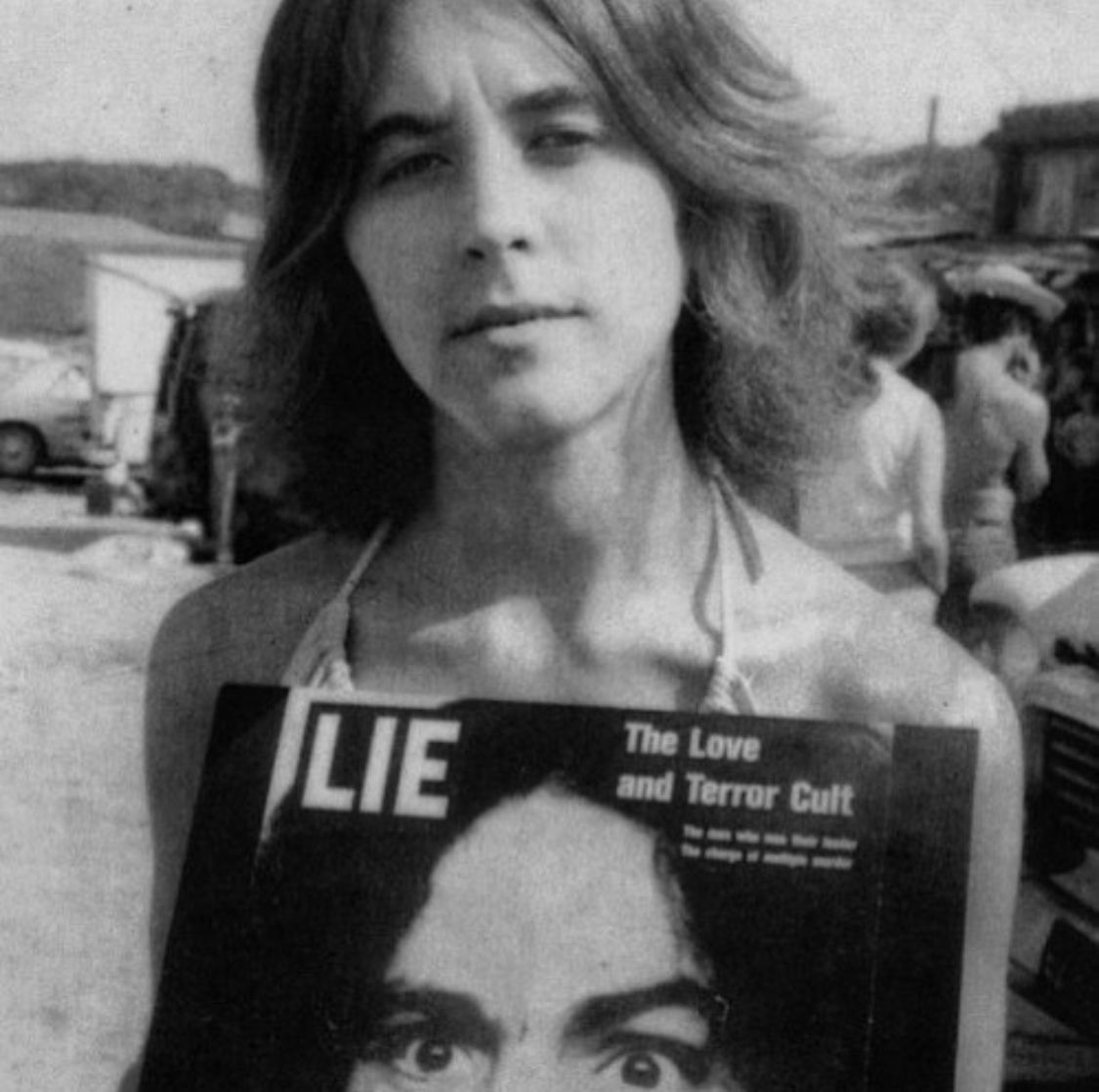Ruth Ann Moorehouse holding Charlie's first record, LIE | Charles manson family, Manson family, Charles manson