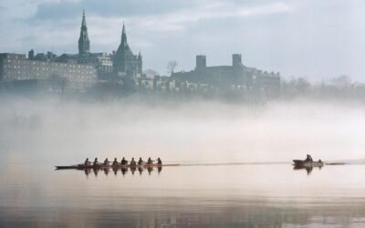 Rowers Gliding Past Georgetown University on the Potomac in the Dim Light of Dawn