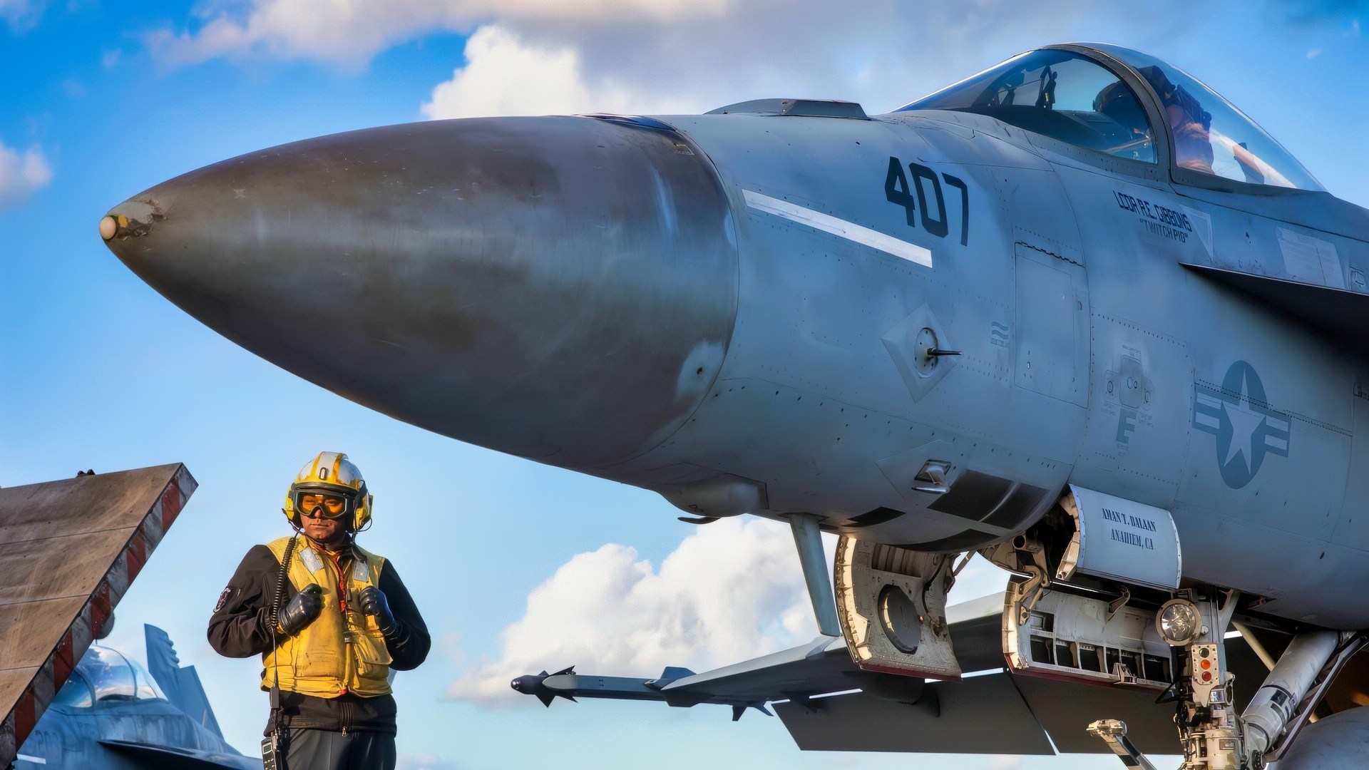 Aviation Boatswain’s Mate (Aircraft Handling) 1st Class Jose Mejiacastro, assigned to Air Department aboard the world's largest aircraft carrier, USS Gerald R. Ford (CVN 78), prepares to signal to a Carrier Air Wing 8 F/A-18E Super Hornet attached to Strike Fighter Squadron 87 on the flight deck, Sept. 26, 2025. Gerald R. Ford, a first-in-class aircraft carrier and deployed flagship of Carrier Strike Group Twelve, is on a scheduled deployment in the U.S. 6th Fleet area of operations to support the warfighting effectiveness, lethality and readiness of U.S. Naval Forces Europe-Africa, and defend U.S., Allied and partner interests in the region. (U.S. Navy photo by Mass Communication Specialist 2nd Class Mariano Lopez)