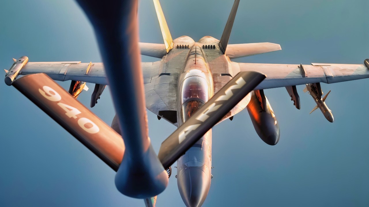A U.S. Navy EA-18G Growler prepares to refuel from a U.S. Air Force KC-135 Stratotanker over the U.S. Central Command area of responsibility, March 29, 2025. The Growlers are assigned to the Harry S. Truman Carrier Strike Group supporting maritime security operations in the CENTCOM AOR. (U.S. Air Force photo by Staff Sgt. Gerald R. Willis)