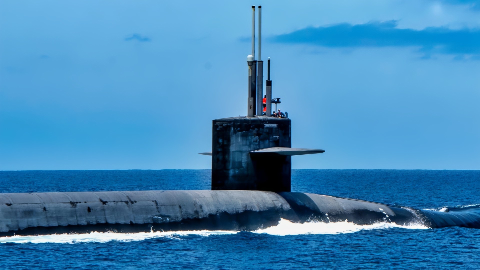 (July 29, 2025) - A U.S. Air Force A10C Thunderbolt II flies over the Ohio-class ballistic missile submarine USS Kentucky (SSBN 737) in the Pacific Ocean, July 29, 2025. The armed airborne escort exercise is designed to increase and demonstrate the Joint Force’s capability to protect strategic assets like Kentucky. Submarine Group (SUBGRU) 9, exercises administrative and operational control authority for assigned submarine commands and units in the Pacific Northwest providing oversight for shipboard training, personnel, supply and material readiness of submarines and their crews. SUBGRU-9 is also responsible for nuclear submarines undergoing conversion or overhaul at Puget Sound Naval Shipyard in Bremerton, Washington. (U.S. Navy Photo by Lt. Zachary Anderson)