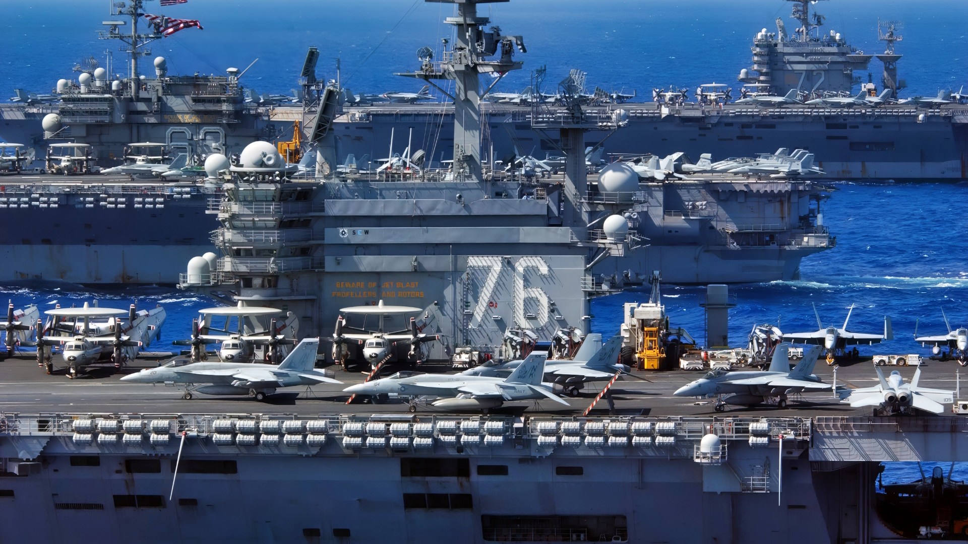 USS Ronald Reagan (CVN 76), USS Kitty Hawk (CV 63), and USS Abraham Lincoln (CVN 72) cruise side-by-side in the Philippine Sea June 18, 2006, during exercise Valiant Shield 2006. The joint exercise consists of 28 naval vessels, more than 300 aircraft, and approximately 20,000 service members from the Navy, Army, Air Force, Marine Corps and Coast Guard. (U.S. Navy photo by Chief Photographer's Mate Spike Call) (Released)